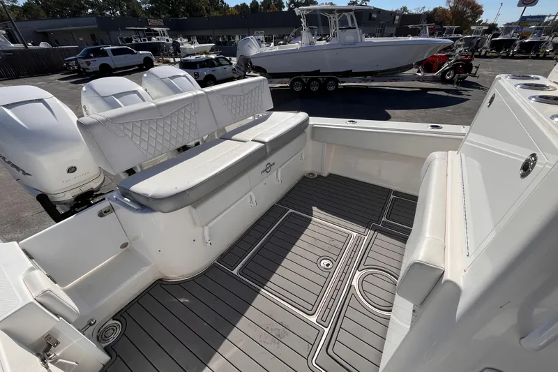  Yacht Photos Pics 2019 Fountain 38 Center Console boat interior with seating and outboard engines.