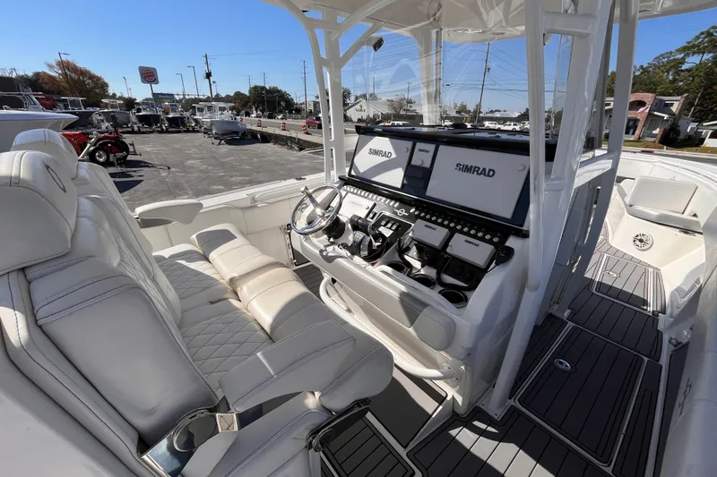  Yacht Photos Pics 2019 Fountain 38 Center Console boat interior with Simrad electronics and luxurious seating.