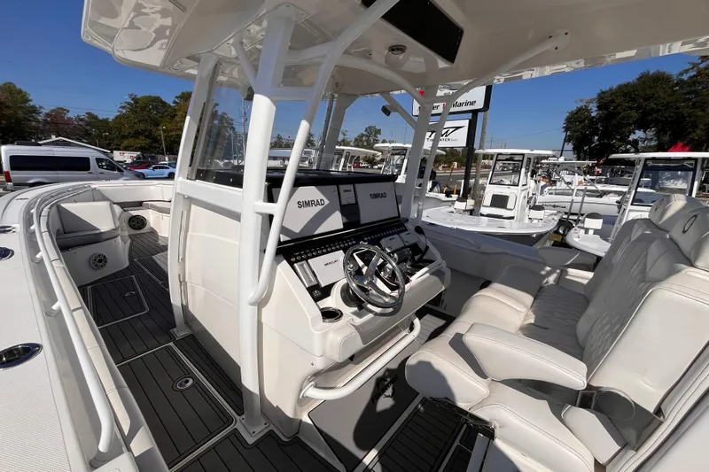 Yacht Photos Pics 2019 Fountain 38 Center Console boat interior with Simrad electronics and luxurious seating.