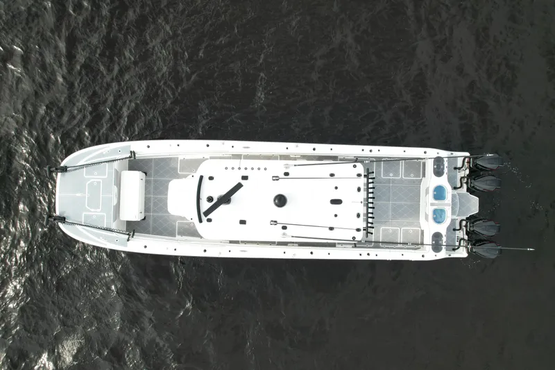 Amazing Grace Yacht Photos Pics Aerial view of 2022 Invincible 46 Catamaran on dark water.