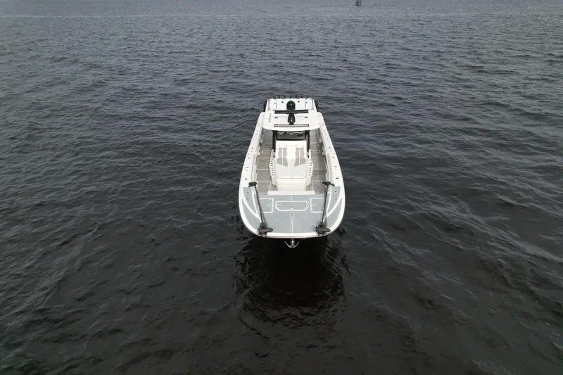 Amazing Grace Yacht Photos Pics 2022 Invincible 46 Catamaran on open water, aerial view.