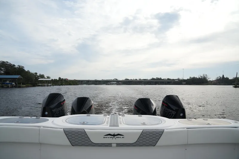 Amazing Grace Yacht Photos Pics Invincible 46 Catamaran 2022 with four engines on a calm river.