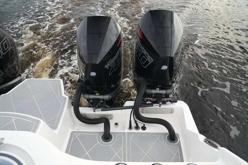 Amazing Grace Yacht Photos Pics Twin outboard engines on a 2022 Invincible 46 Catamaran in motion.