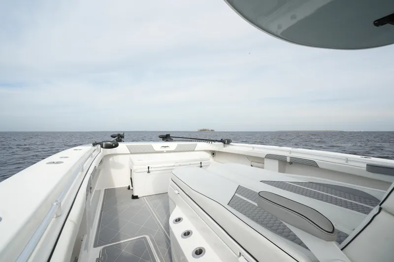 Amazing Grace Yacht Photos Pics 2022 Invincible 46 Catamaran on open water, showcasing spacious deck and sleek design.