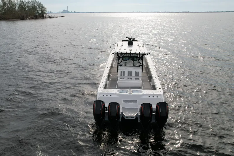 Amazing Grace Yacht Photos Pics Invincible 46 Catamaran 2022 cruising on open water, rear view.