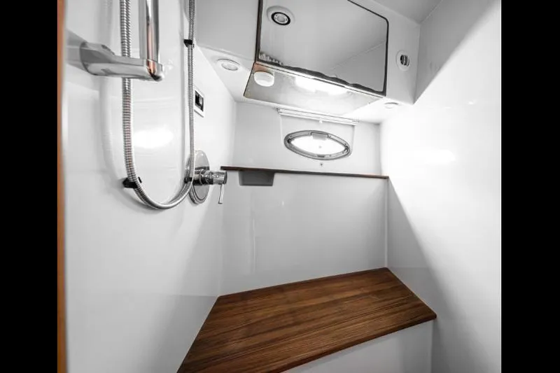 Pura Vida Yacht Photos Pics Luxurious 2011 Four Winns 475 yacht bathroom with sleek design and wooden accents.