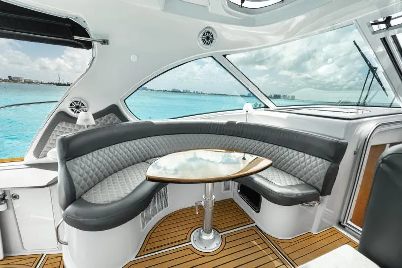 Pura Vida Yacht Photos Pics Luxurious interior of 2011 Four Winns 475 yacht with elegant seating and ocean view.
