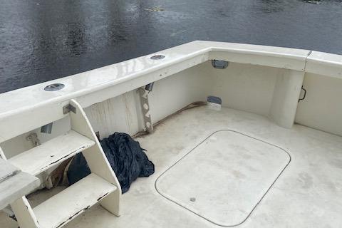 1984 Post 43 Sport Fisherman boat deck with steps and storage hatch.