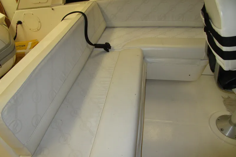 Yeah Yacht Photos Pics 1999 Bayliner 4788 Pilot House Motoryacht interior seating area with white upholstery.