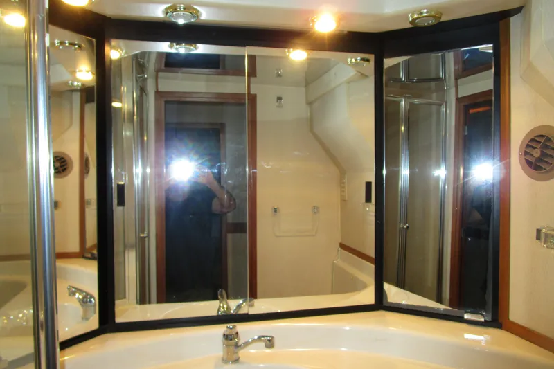 Yeah Yacht Photos Pics Bathroom vanity with mirrors and lighting in 1999 Bayliner 4788 Pilot House Motoryacht.