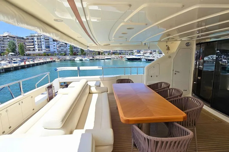 M/y Bleu Blanc Yacht Photos Pics Luxurious 2009 Ferretti Custom Line 97 yacht with elegant outdoor seating and marina view.