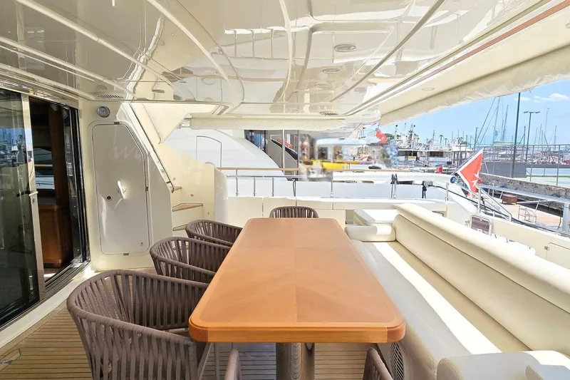 M/y Bleu Blanc Yacht Photos Pics Luxurious 2009 Ferretti Custom Line 97 yacht deck with elegant seating and dining area.