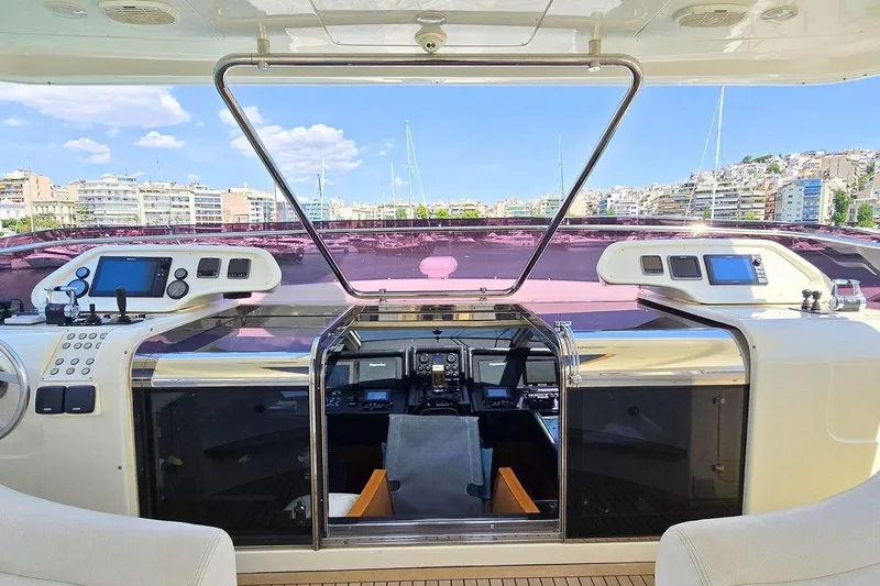 M/y Bleu Blanc Yacht Photos Pics Ferretti Custom Line 97 yacht cockpit, 2009 model, featuring modern navigation equipment and cityscape view.
