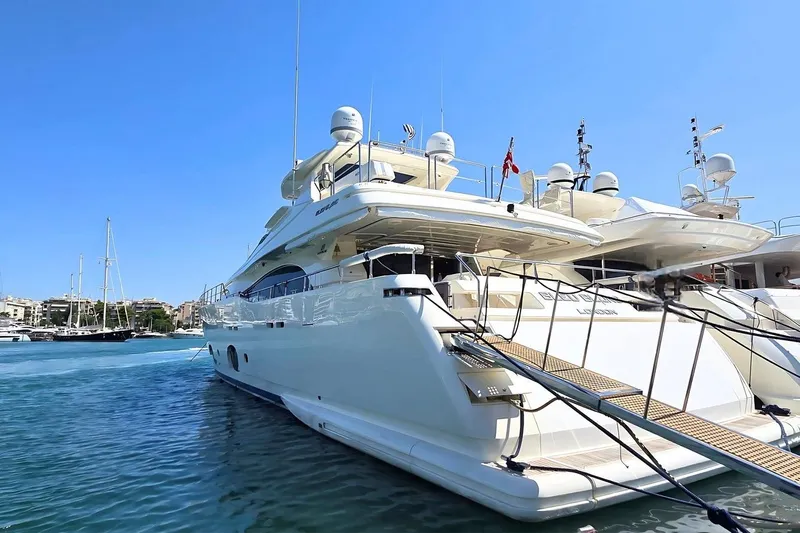 M/y Bleu Blanc Yacht Photos Pics Luxurious 2009 Ferretti Custom Line 97 yacht docked in a sunny marina.