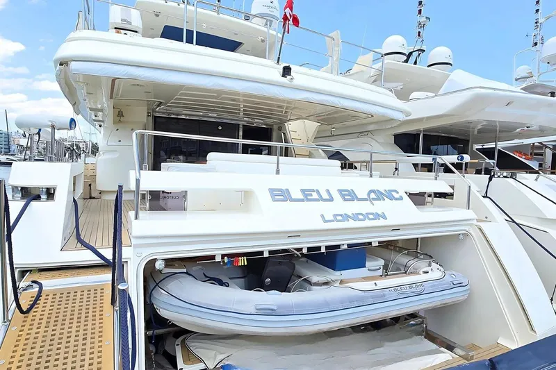 M/y Bleu Blanc Yacht Photos Pics Luxury yacht Ferretti Custom Line 97, 2009, docked with tender boat storage.