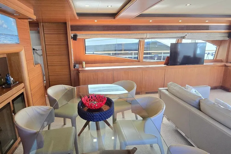 M/y Bleu Blanc Yacht Photos Pics Luxurious interior of 2009 Ferretti Custom Line 97 yacht with elegant dining area.