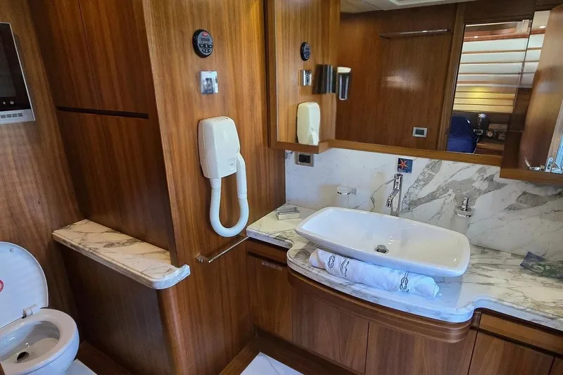 M/y Bleu Blanc Yacht Photos Pics Luxurious bathroom in 2009 Ferretti Custom Line 97 yacht with marble countertops.