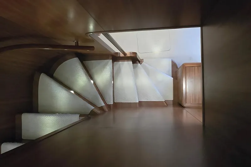 M/y Bleu Blanc Yacht Photos Pics Wooden staircase with white steps inside 2009 Ferretti Custom Line 97 yacht.