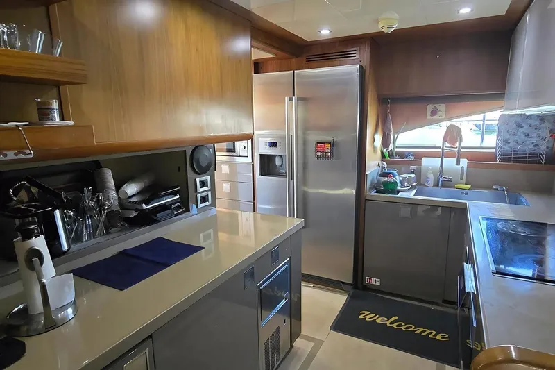 M/y Bleu Blanc Yacht Photos Pics Luxurious kitchen interior of 2009 Ferretti Custom Line 97 yacht with modern appliances.