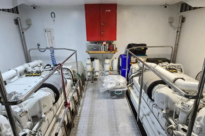 M/y Bleu Blanc Yacht Photos Pics Engine room of 2009 Ferretti Custom Line 97 yacht, featuring dual engines and maintenance equipment.