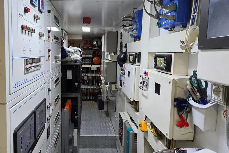 M/y Bleu Blanc Yacht Photos Pics Engine room of 2009 Ferretti Custom Line 97 yacht, featuring control panels and equipment.