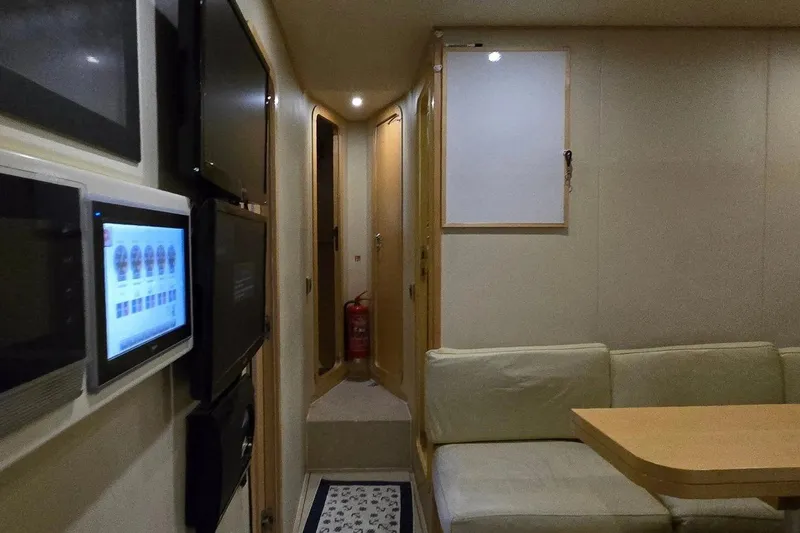 M/y Bleu Blanc Yacht Photos Pics Interior of 2009 Ferretti Custom Line 97 yacht with modern control panels and seating area.