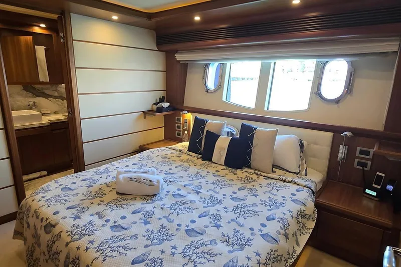 M/y Bleu Blanc Yacht Photos Pics Luxurious bedroom interior of 2009 Ferretti Custom Line 97 yacht with elegant decor.