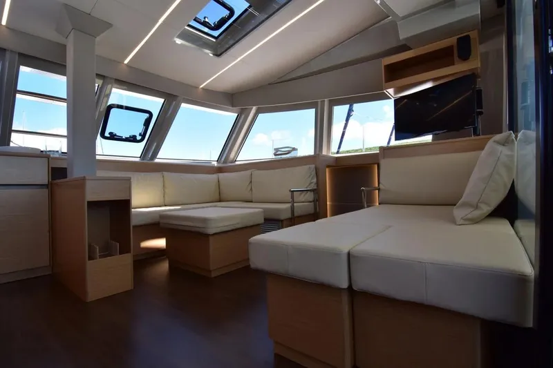 Stefany Yacht Photos Pics Luxurious interior of 2019 Nautitech 46 Fly catamaran with modern seating and large windows.
