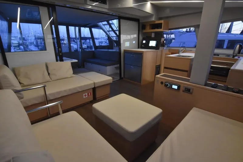 Stefany Yacht Photos Pics Luxurious interior of 2019 Nautitech 46 Fly catamaran with modern seating and kitchen area.