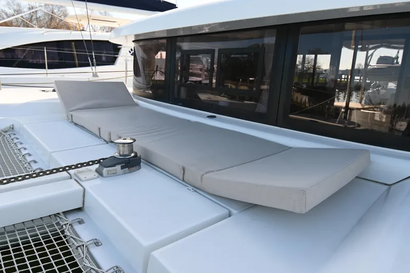 About Time Yacht Photos Pics Luxurious Lagoon 42 catamaran deck with sunbed, 2021 model.