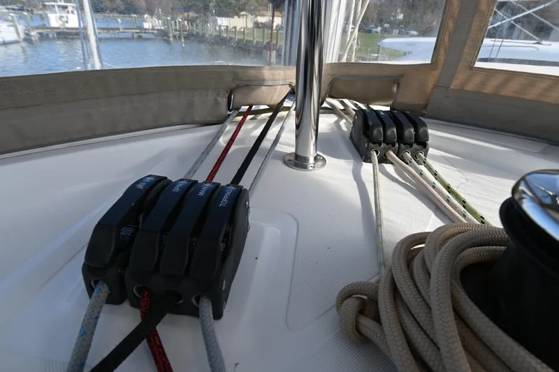 About Time Yacht Photos Pics Rope and pulley system on 2021 Lagoon 42 catamaran deck, near marina.