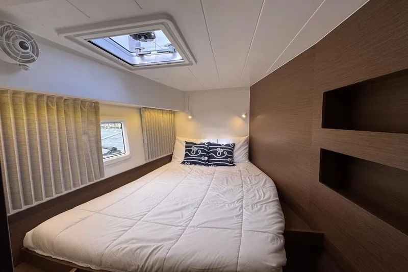 About Time Yacht Photos Pics Cozy bedroom in 2021 Lagoon 42 yacht with modern decor and natural light.