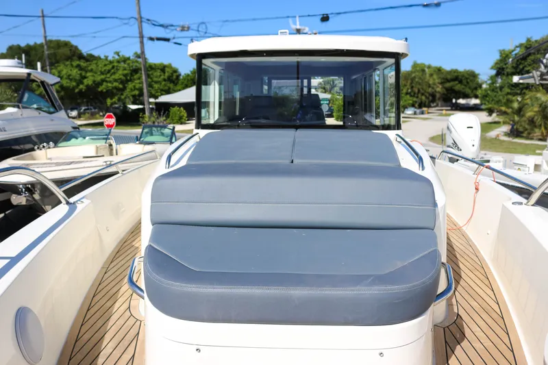 Ocean Therapy Yacht Photos Pics Nimbus C-11 2021 boat with sleek deck and modern design in marina setting.