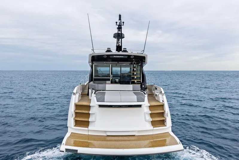  Yacht Photos Pics 2022 Sunseeker 65 Sport Yacht on open sea, rear view.