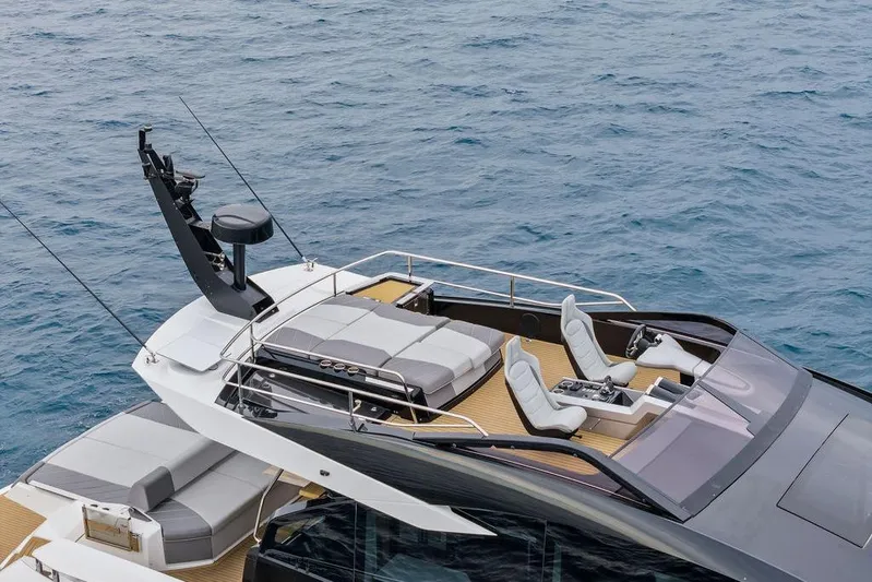  Yacht Photos Pics 2022 Sunseeker 65 Sport Yacht with sleek design and luxurious seating on open water.