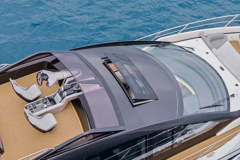  Yacht Photos Pics 2022 Sunseeker 65 Sport Yacht cockpit with sleek design and ocean backdrop.