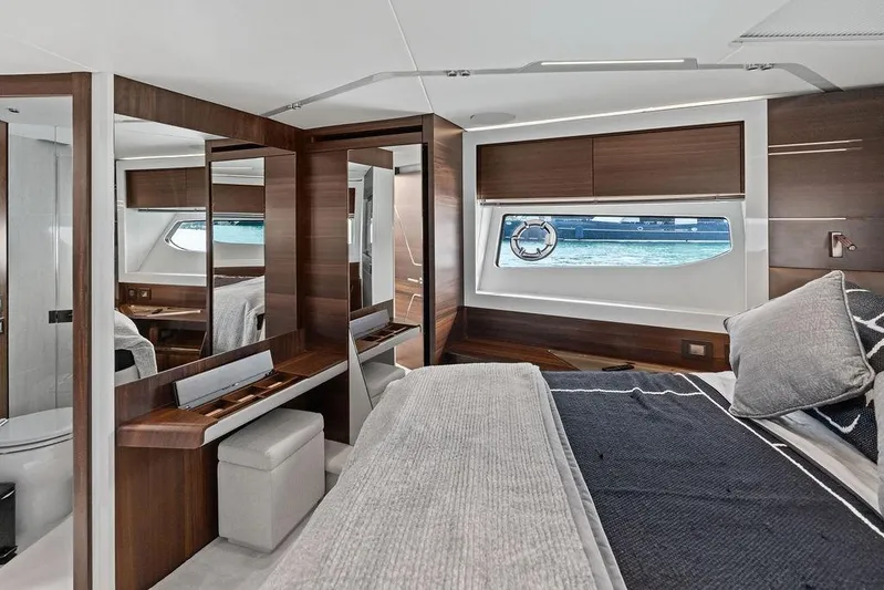  Yacht Photos Pics Luxurious interior of 2022 Sunseeker 65 Sport Yacht with elegant wood finishes and modern design.