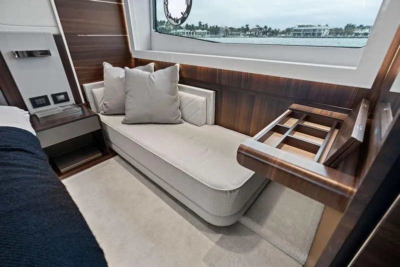  Yacht Photos Pics Luxurious interior of 2022 Sunseeker 65 Sport Yacht with elegant seating and wood accents.