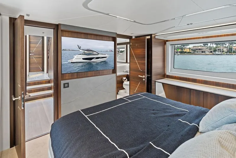  Yacht Photos Pics Luxurious interior of 2022 Sunseeker 65 Sport Yacht with elegant wood finishes and waterfront view.
