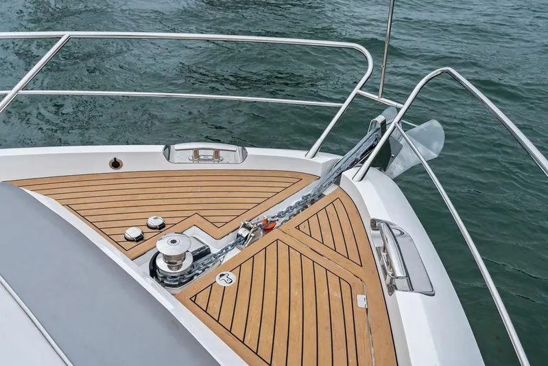 Yacht Photos Pics Bow of 2022 Sunseeker 65 Sport Yacht with teak decking and anchor chain.