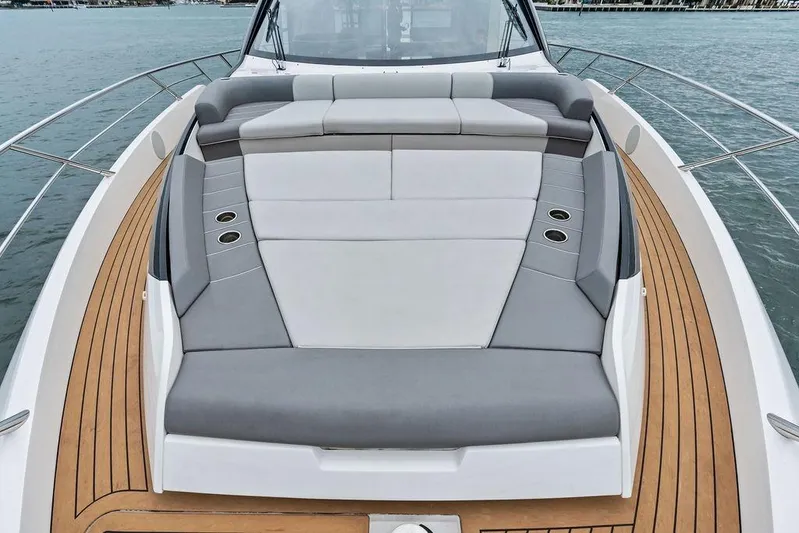  Yacht Photos Pics 2022 Sunseeker 65 Sport Yacht deck with luxurious seating and teak flooring.