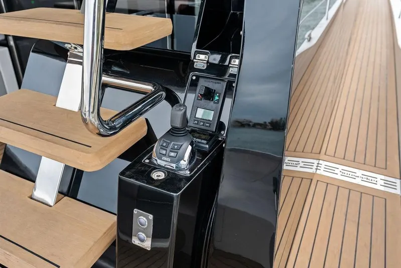  Yacht Photos Pics 2022 Sunseeker 65 Sport Yacht control panel and teak deck detail.