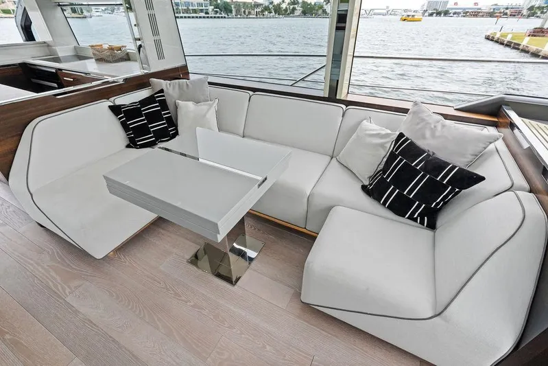  Yacht Photos Pics Luxurious interior of 2022 Sunseeker 65 Sport Yacht with modern seating and elegant decor.