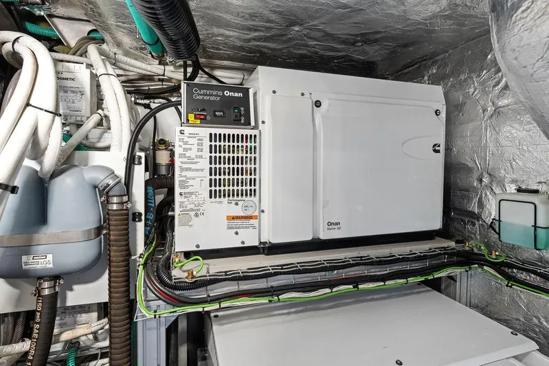  Yacht Photos Pics Engine room of 2022 Sunseeker 65 Sport Yacht with Cummins Onan generator.