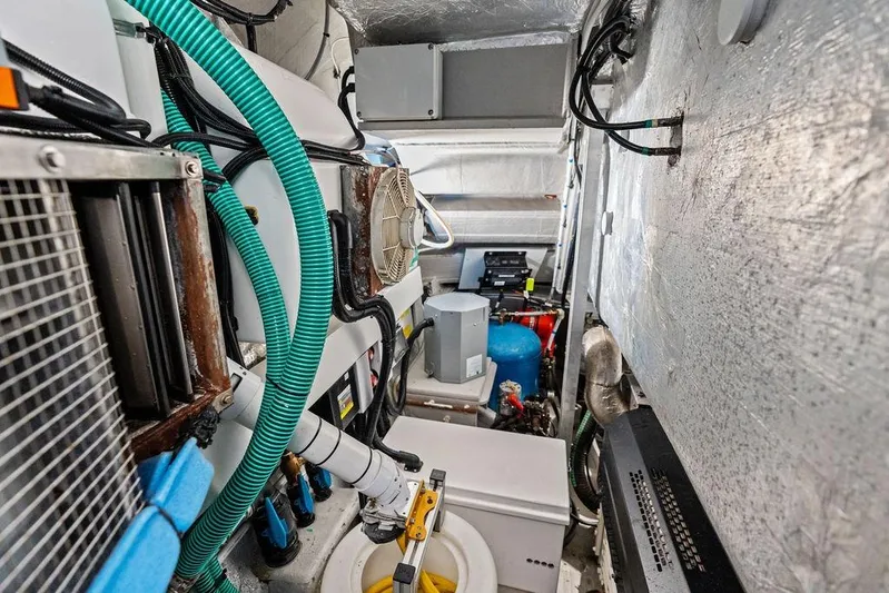  Yacht Photos Pics Engine room of 2022 Sunseeker 65 Sport Yacht with complex machinery and wiring.