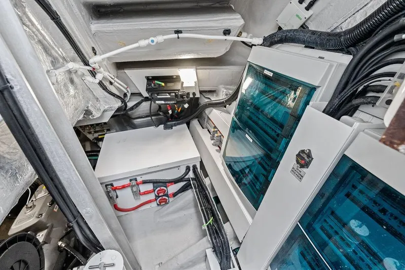  Yacht Photos Pics Engine room of 2022 Sunseeker 65 Sport Yacht, showcasing electrical systems and wiring.