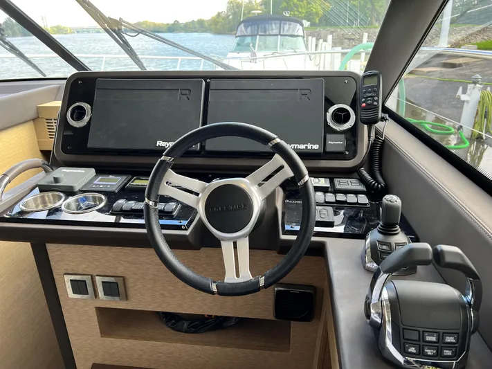  Yacht Photos Pics Helm of 2018 Prestige 460 yacht with advanced navigation controls and steering wheel.