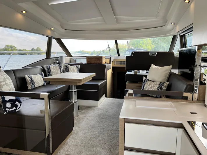  Yacht Photos Pics Luxurious interior of a 2018 Prestige 460 yacht with modern seating and elegant decor.