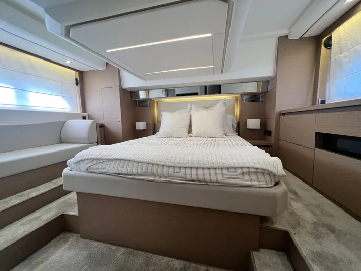  Yacht Photos Pics Luxurious interior of a 2018 Prestige 460 yacht with a spacious, elegant bedroom.