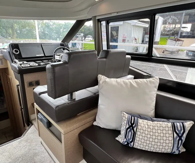  Yacht Photos Pics Interior of 2018 Prestige 460 yacht with modern seating and decorative pillows.